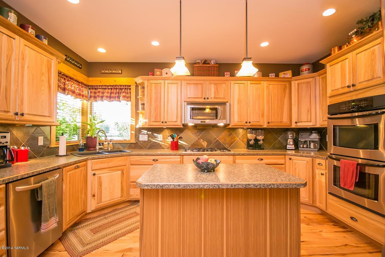 1292 Deeringhoff Road Moxee, WA 98936 - Photo 11 of 42 a large kitchen with lots of counter space and a window