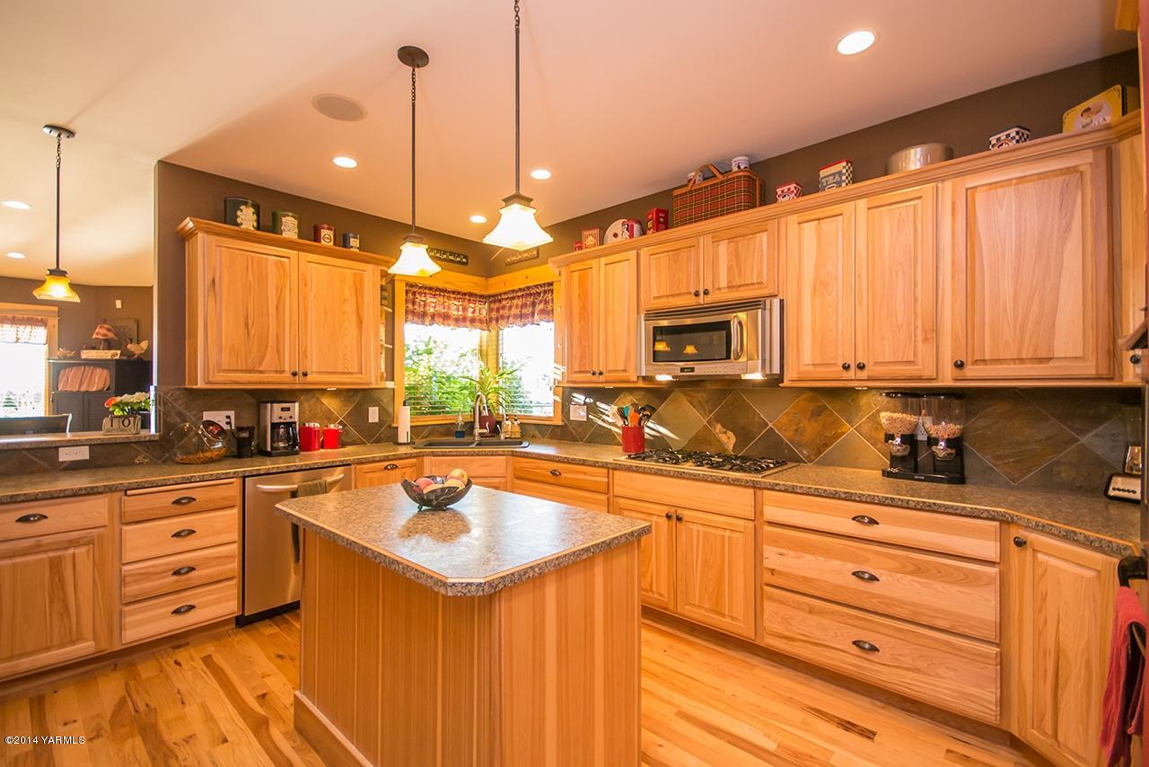 1292 Deeringhoff Road Moxee, WA 98936 - Photo 12 of 42 a kitchen with a sink stove and microwave