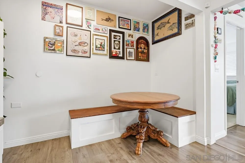 712 Lemon Avenue Vista, CA 92084 - Photo 12 of 29 a view of a room with table and paintings on the wall