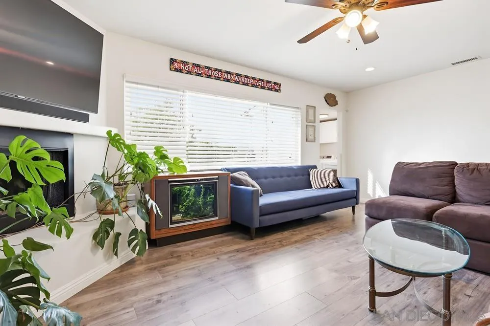 712 Lemon Avenue Vista, CA 92084 - Photo 14 of 29 a living room with furniture and a wooden floor