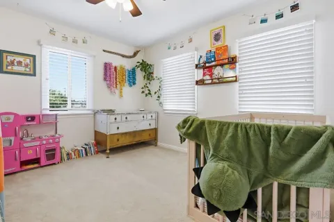 a bedroom with furniture and a window