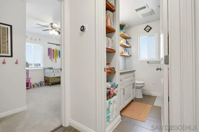 a bathroom with a sink toilet and a shower
