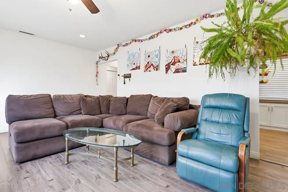 712 Lemon Avenue Vista, CA 92084 - Photo 26 of 29 a living room with furniture and a potted plant