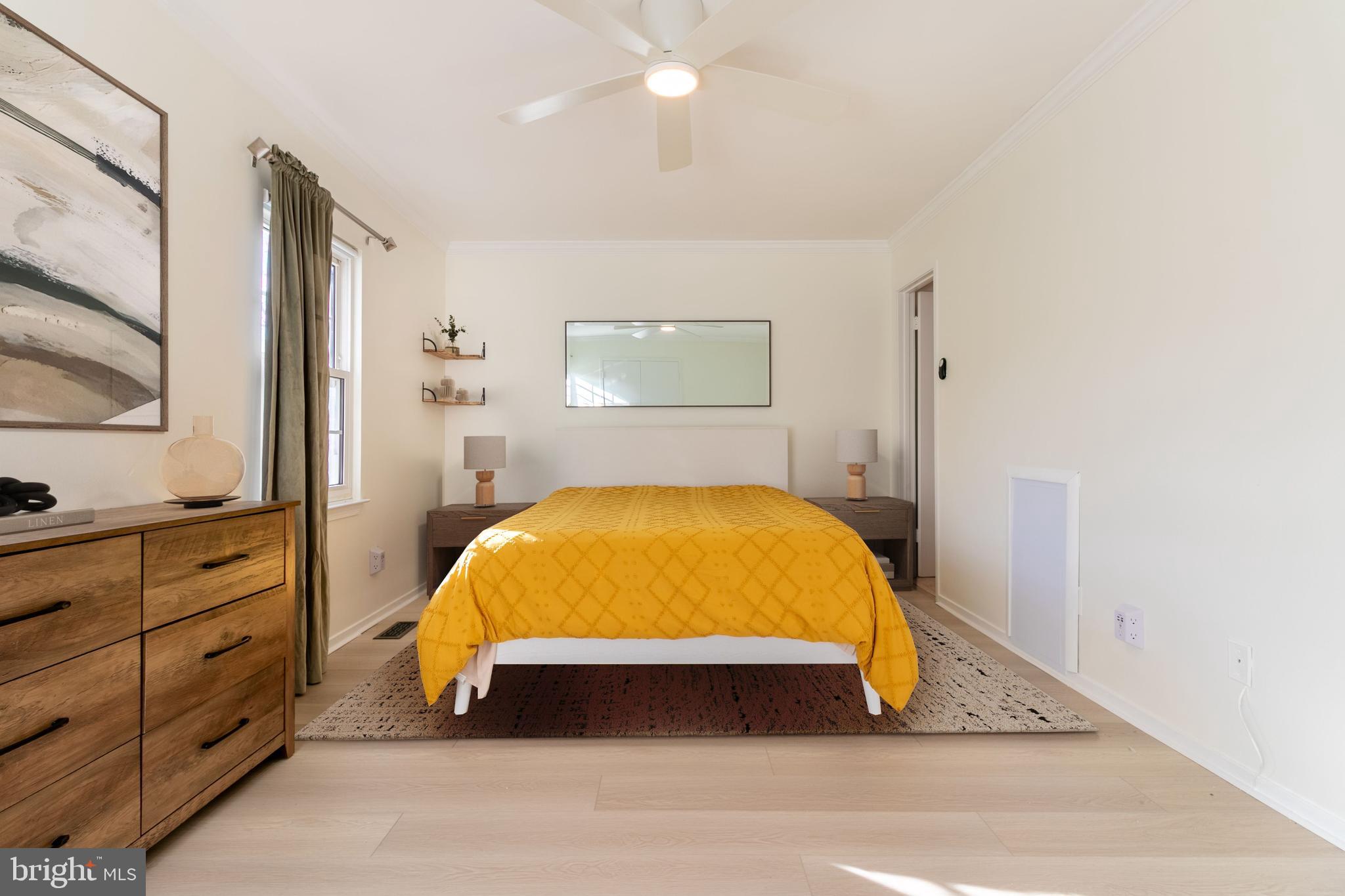 17411 Pipers Way, Unit 7 Olney, MD 20832 - Photo 18 of 22 a bed sitting in a bedroom next to a lamp on dresser and a window