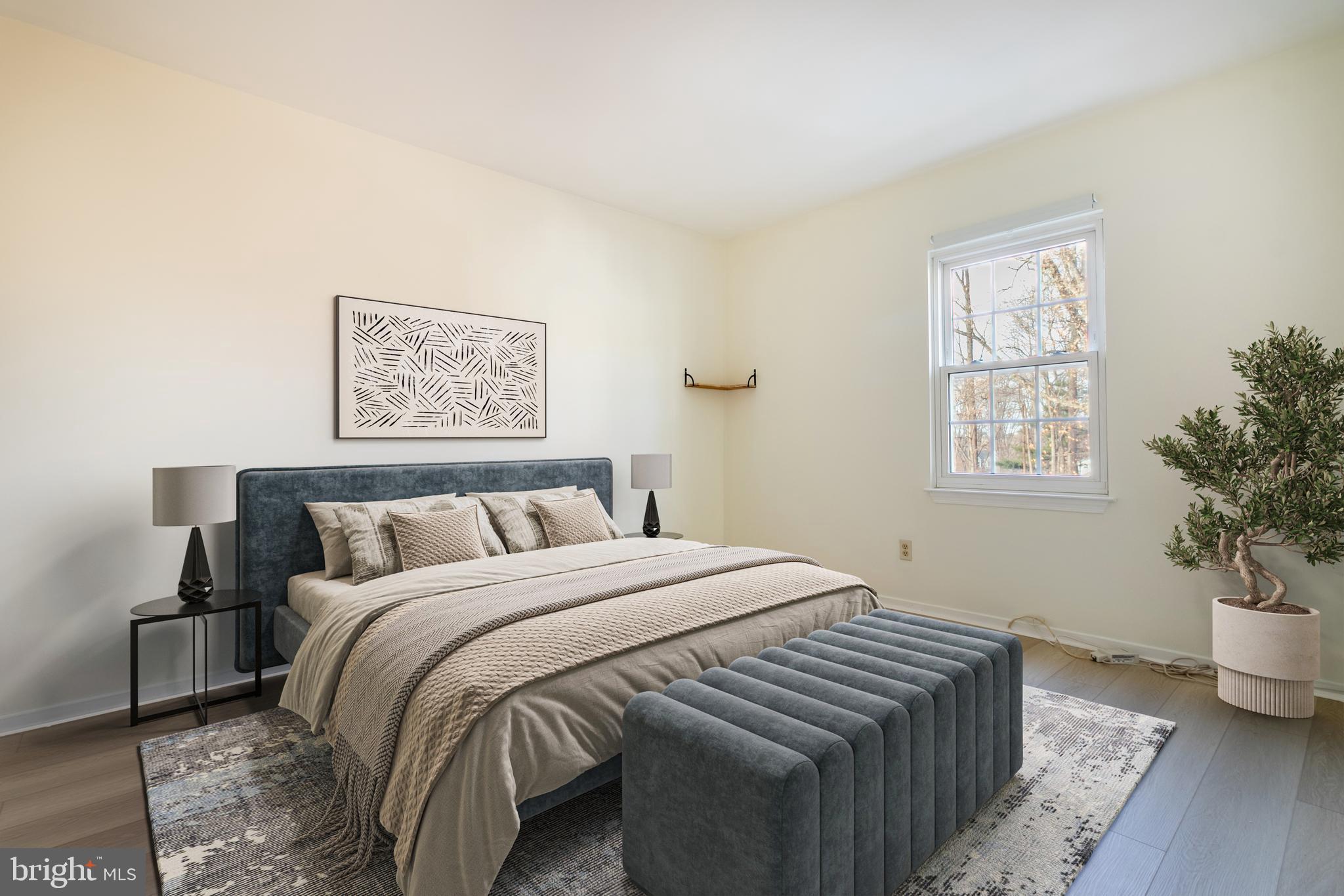 17411 Pipers Way, Unit 7 Olney, MD 20832 - Photo 19 of 22 a bedroom with a bed and a potted plant