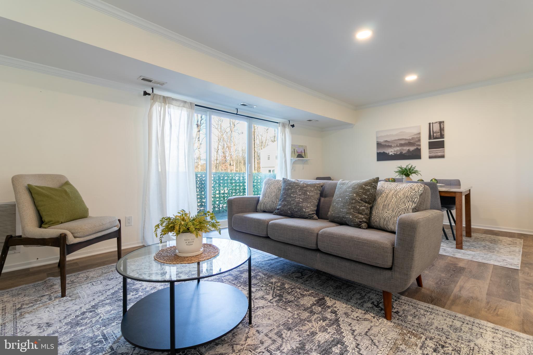 17411 Pipers Way, Unit 7 Olney, MD 20832 - Photo 4 of 22 a living room with furniture and a table