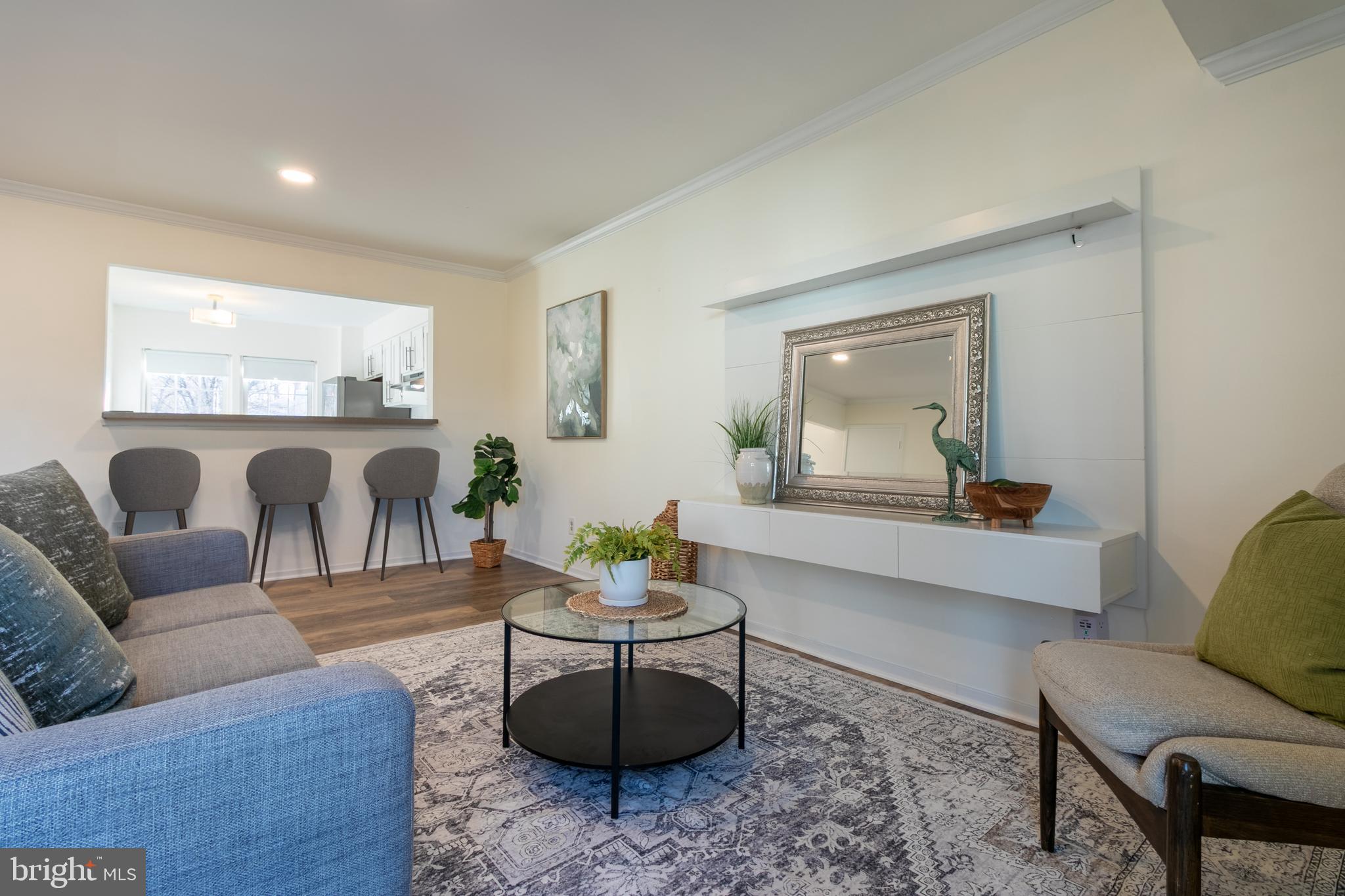 17411 Pipers Way, Unit 7 Olney, MD 20832 - Photo 5 of 22 a living room with furniture and a large window
