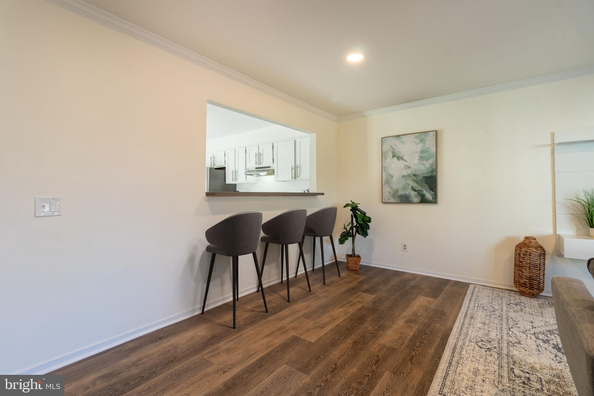 17411 Pipers Way, Unit 7 Olney, MD 20832 - Photo 7 of 22 a view of a livingroom with furniture and wooden floor