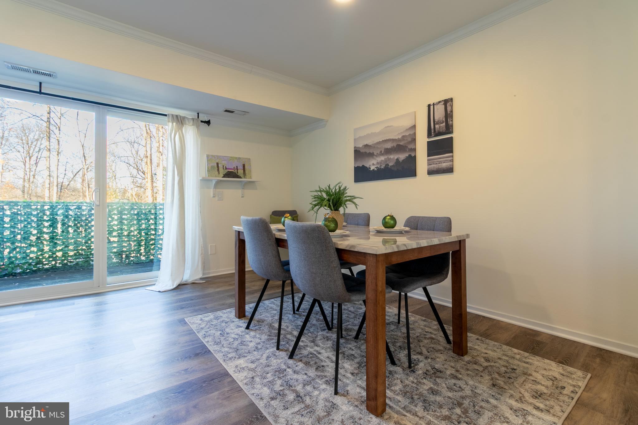 17411 Pipers Way, Unit 7 Olney, MD 20832 - Photo 8 of 22 a view of a dining room with furniture and wooden floor