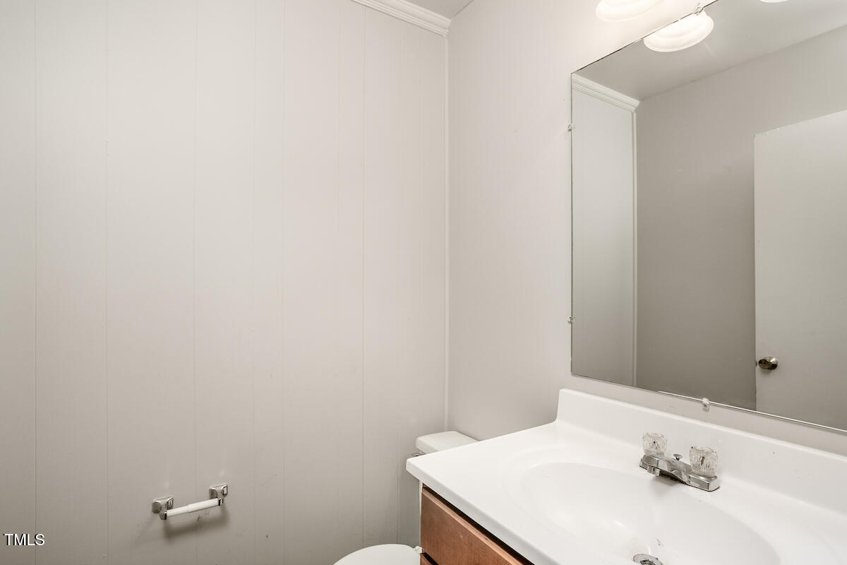 4912 Auburn Road Raleigh, NC 27609 - Photo 14 of 23 a bathroom with a sink and a toilet