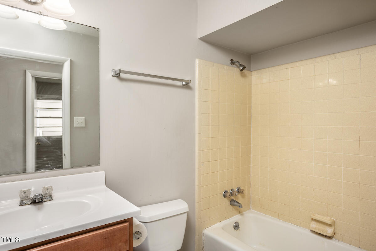 4912 Auburn Road Raleigh, NC 27609 - Photo 17 of 23 a bathroom with a sink toilet and shower