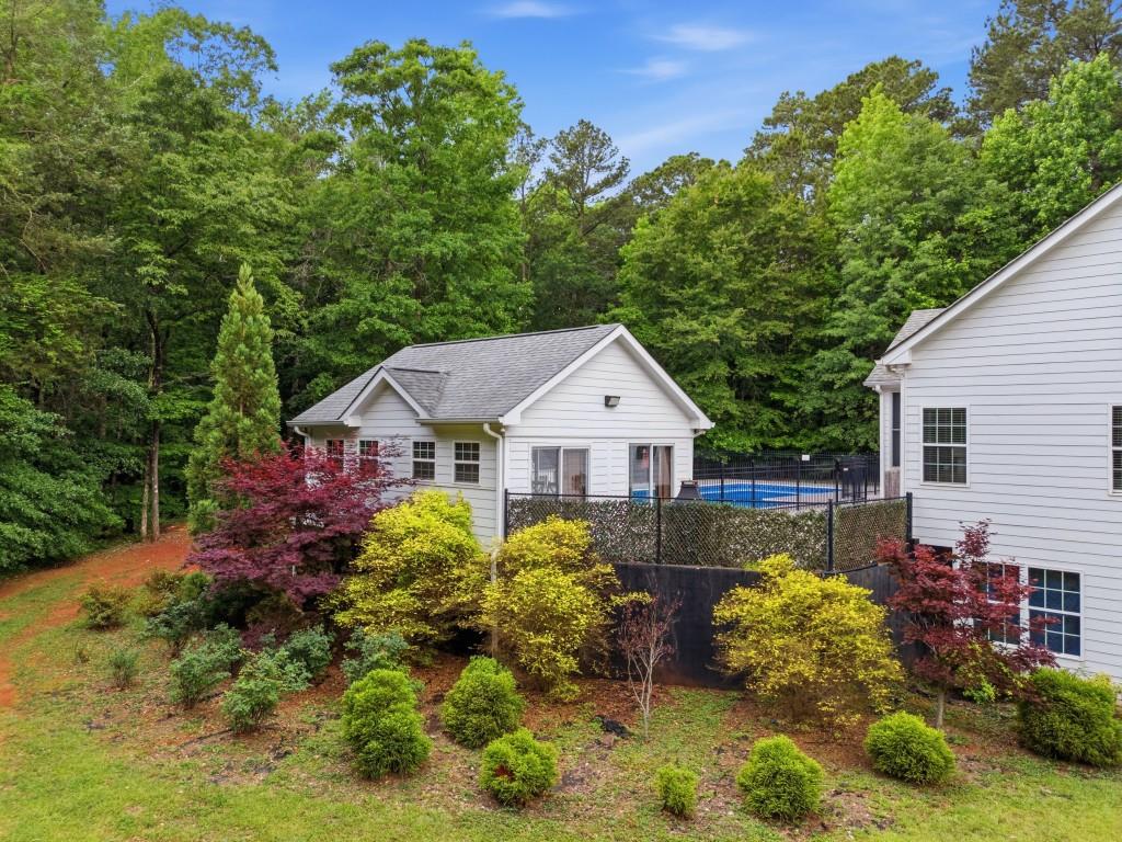 582 Knox Chapel Road Social Circle, GA 30025 - Photo 40 of 49 a view of a house with a big yard and potted plants