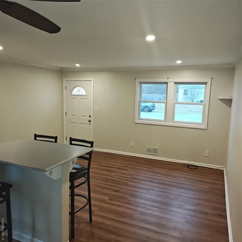 a view of a livingroom with wooden floor