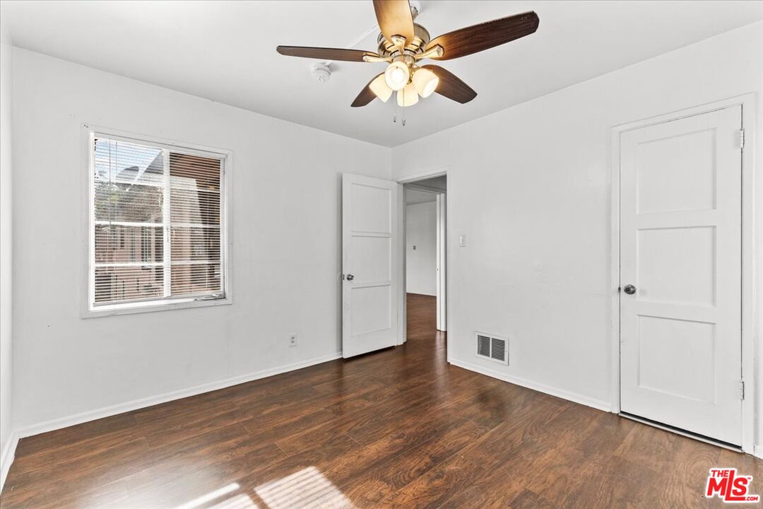 4045 Abourne Road, Unit D Los Angeles, CA 90008 - Photo 8 of 17 wooden floor in an empty room with a window