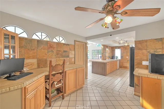a bathroom with a sink mirror and vanity