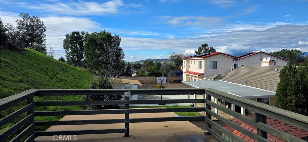 24224 High Knob Road Diamond Bar, CA 91765 - Photo 2 of 6 a view of a street with wooden stairs and bench in front of house