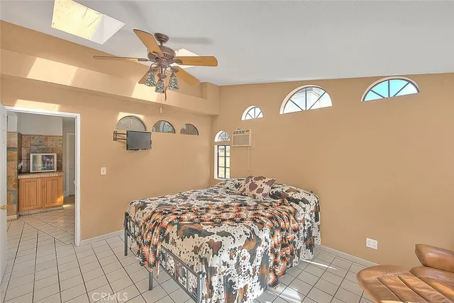 a bedroom with a bed and dresser