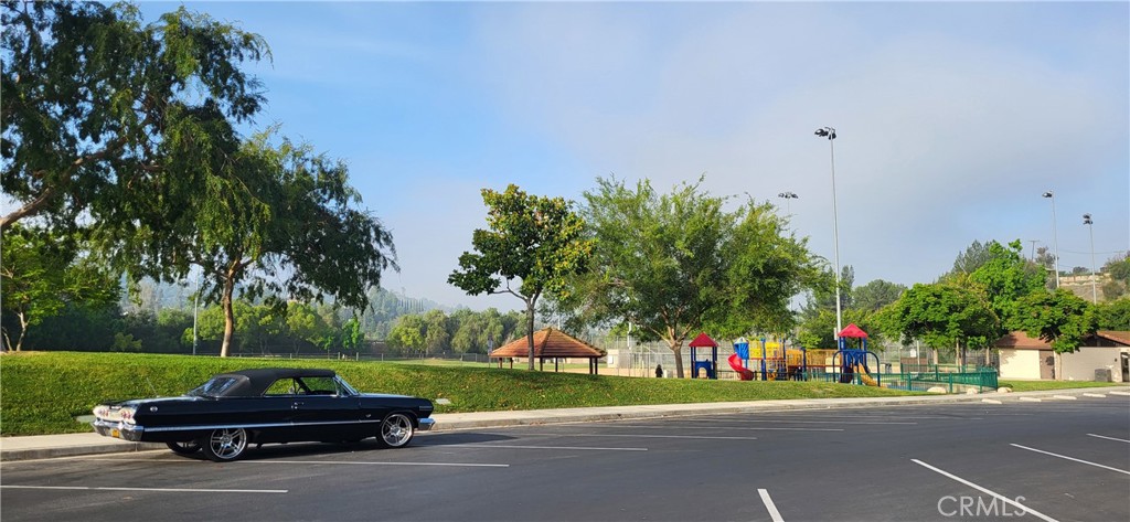 24224 High Knob Road Diamond Bar, CA 91765 - Photo 6 of 6 a car parked in front of a house with a yard