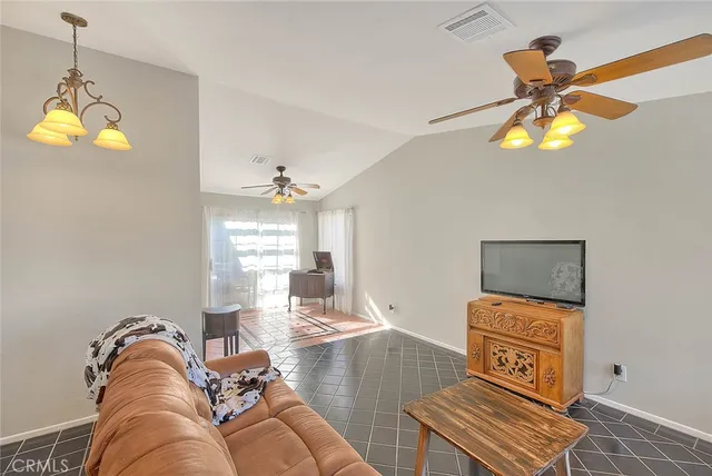 a kitchen with stainless steel appliances granite countertop a stove a refrigerator and a microwave