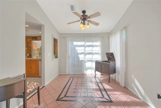 a kitchen with stainless steel appliances granite countertop a refrigerator a stove and a sink with cabinets