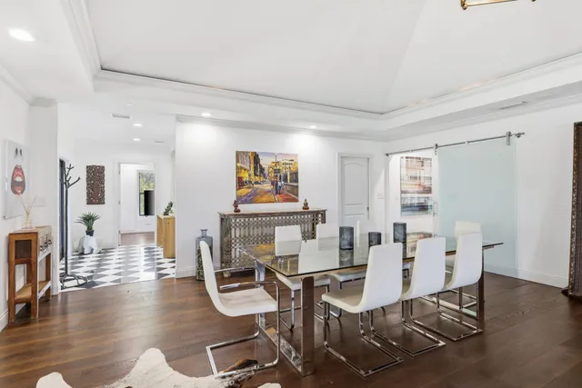 a kitchen with a table and chairs in it