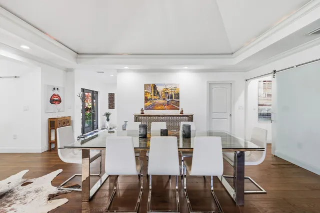 a kitchen with stainless steel appliances a stove and a large window