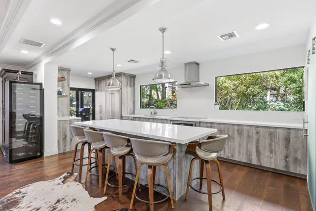 a kitchen with a sink and a large window