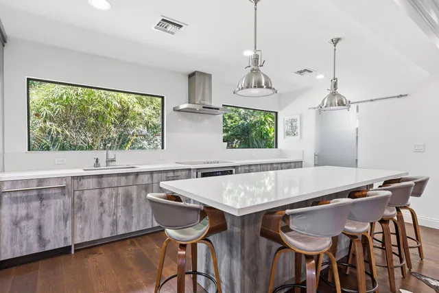 a white bath tub sitting next to a shower