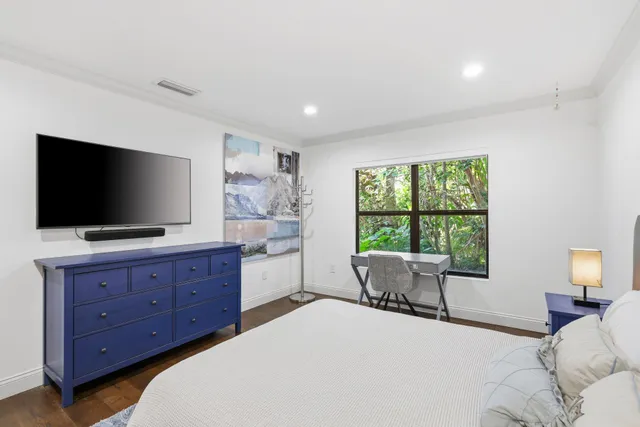 a dining room with furniture and garden view