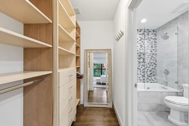 an aerial view of a house with garden space and a swimming pool