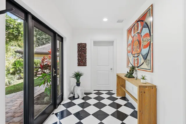 a view of a dining room with furniture wooden floor and chandelier