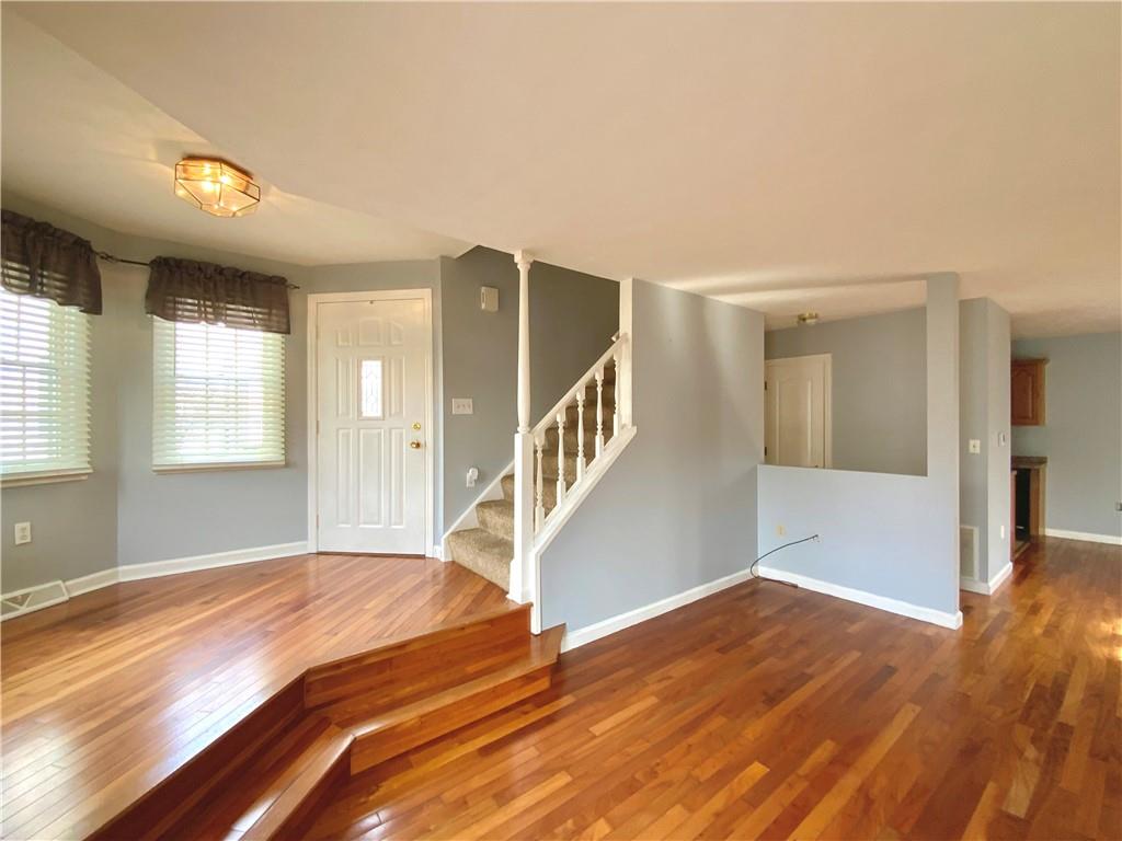 380 3rd Street, Unit 380 Beaver, PA 15009 - Photo 8 of 25 a view of a livingroom with wooden floor and stairs