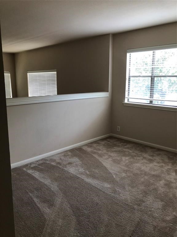 2438 Bering Drive, Unit 2438 Houston, TX 77057 - Photo 14 of 19 a view of an empty room with a window