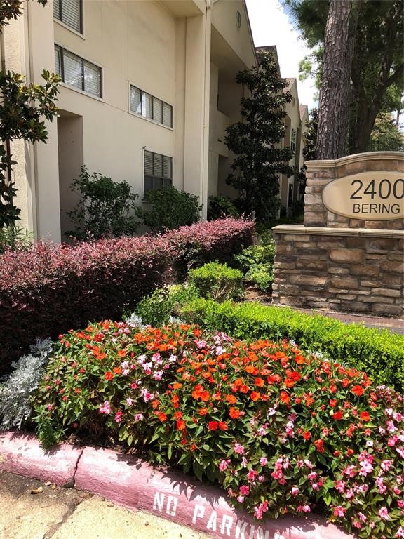 2438 Bering Drive, Unit 2438 Houston, TX 77057 - Photo 2 of 19 a view of a bunch of flowers in front of house