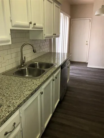 a kitchen with a stove and a microwave