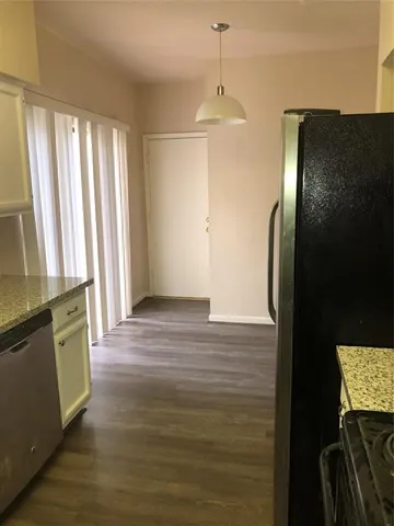 a kitchen with stainless steel appliances a stove and a refrigerator