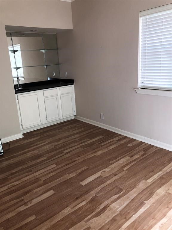 2438 Bering Drive, Unit 2438 Houston, TX 77057 - Photo 9 of 19 a wooden floor with window