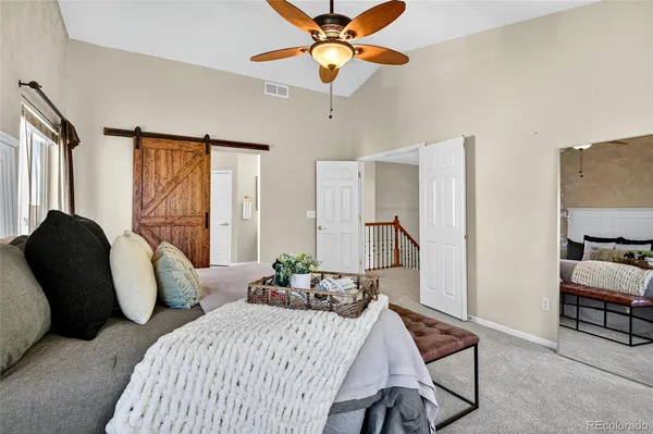 a spacious bathroom with a double vanity sink and a mirror