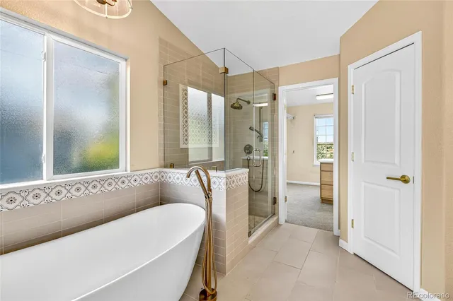 a spacious bathroom with a double vanity sink and a mirror