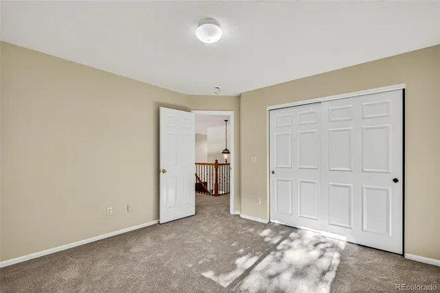 a view of an empty room and closet area