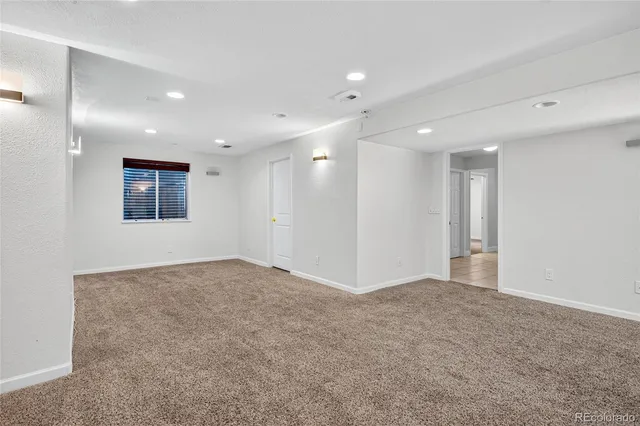 an aerial view of a house with outdoor space and city view