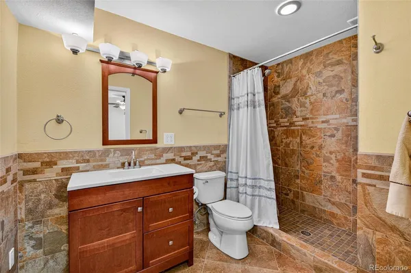 an aerial view of a house with a yard and fountain in front of it