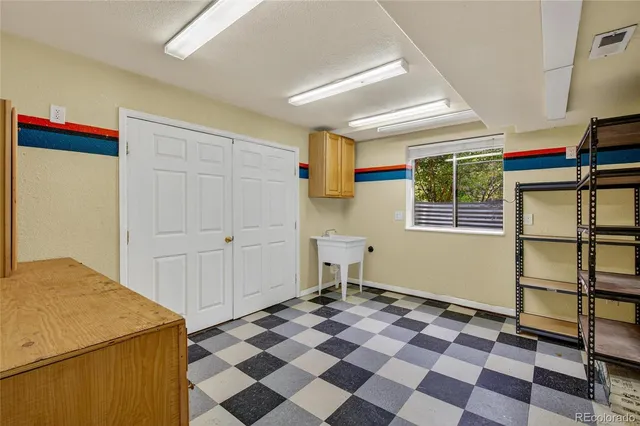 an aerial view of a house with a yard and fountain in front of it