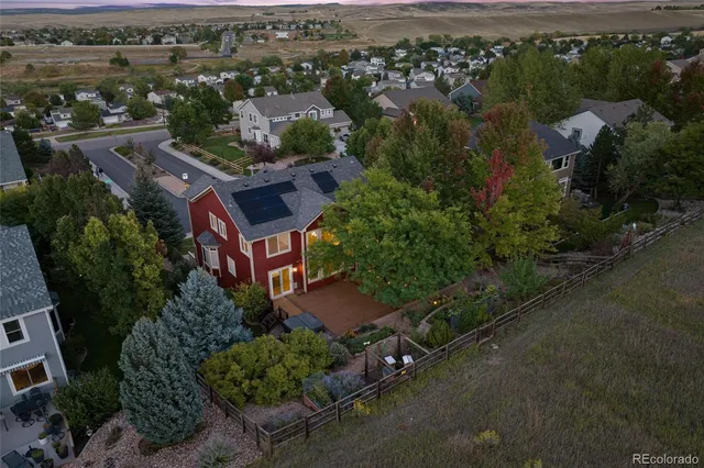 an aerial view of a house with a garden