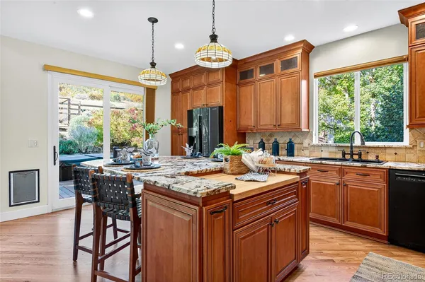 a living room with furniture large window and a table
