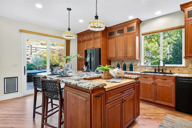 a living room with furniture and a painting on the wall