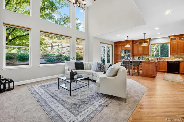 a view of an empty room with window and fire place
