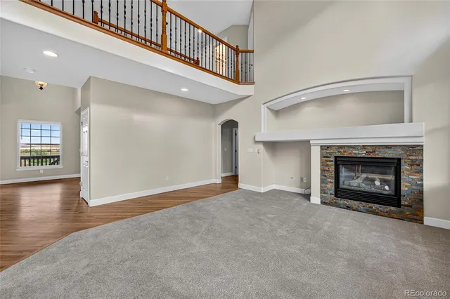 a view of entryway with wooden floor and stairs