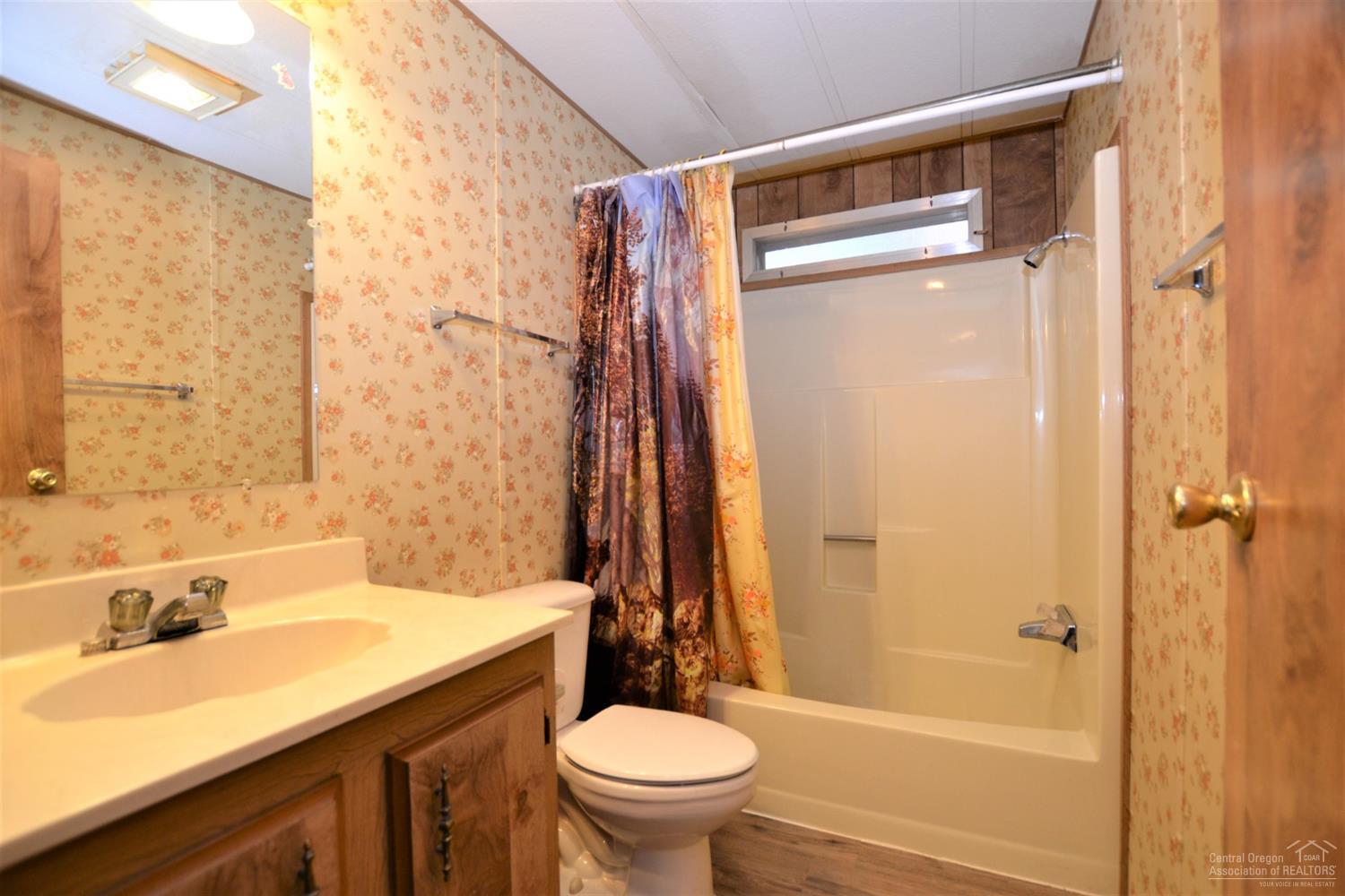 60176 Agate Road Bend, OR 97702 - Photo 16 of 21 a bathroom with a sink a toilet and shower
