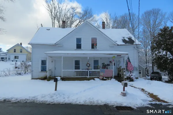 a view of house with a yard